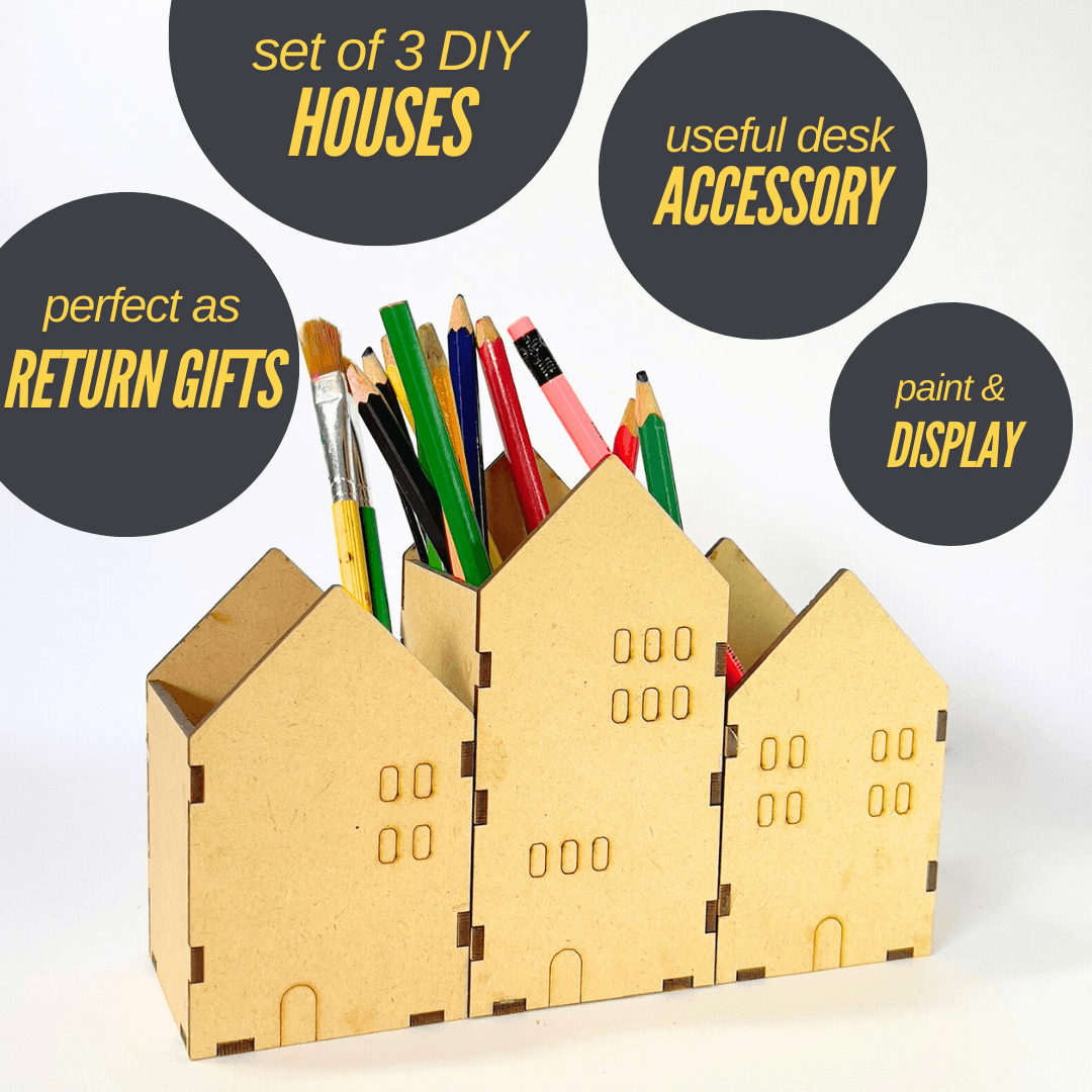 Three DIY tiny house pen stands arranged as a desk set