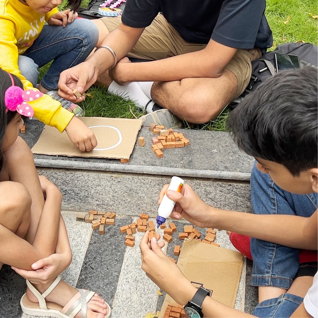 Group activity with children building using miniature bricks
