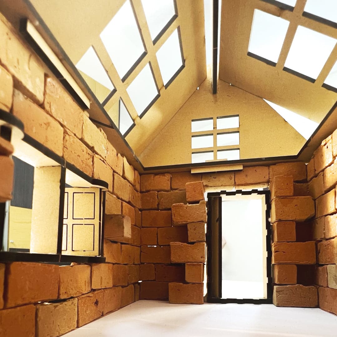Interior view of the finished miniature brick play house with roof open