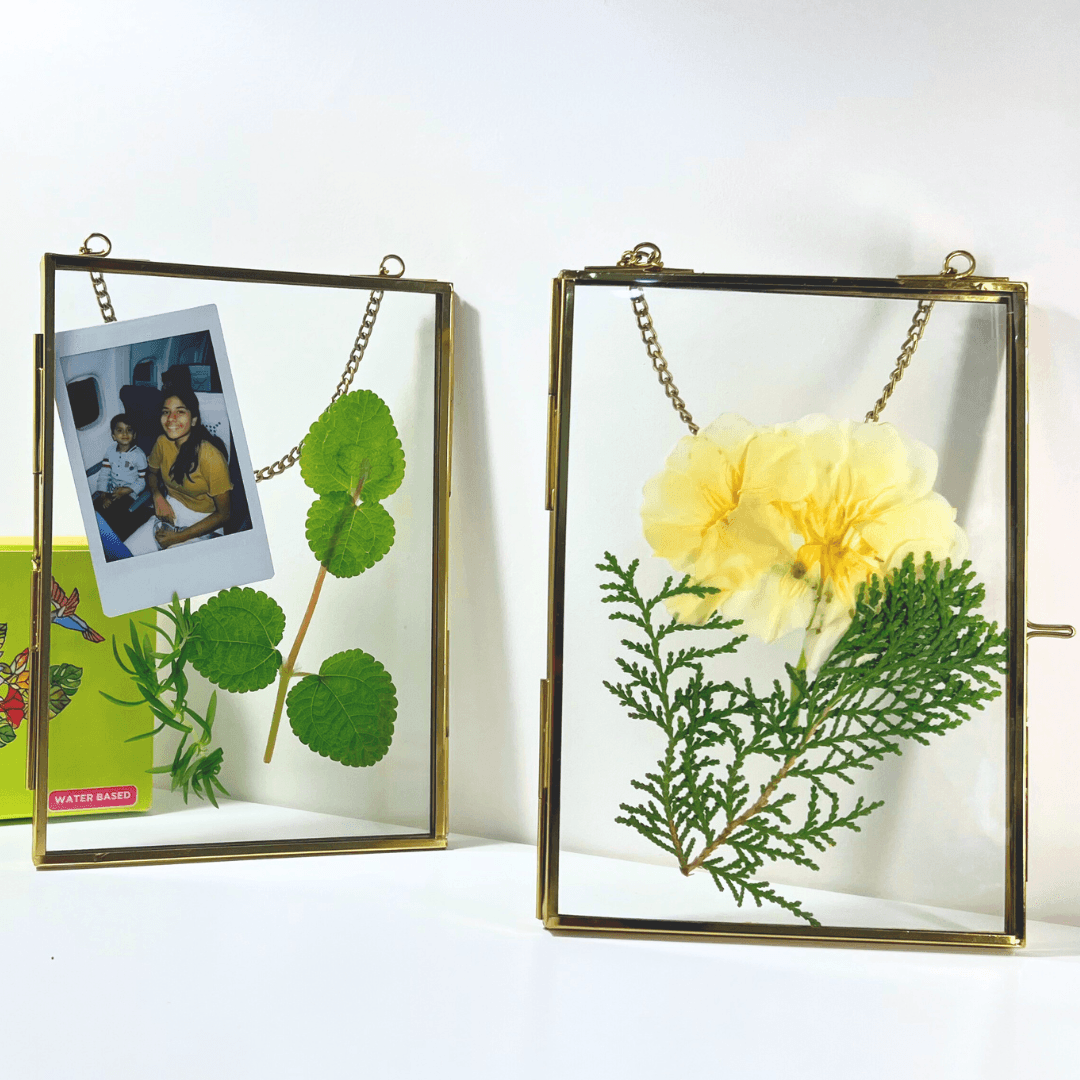 Golden hanging photo frame displayed with keepsakes inside
